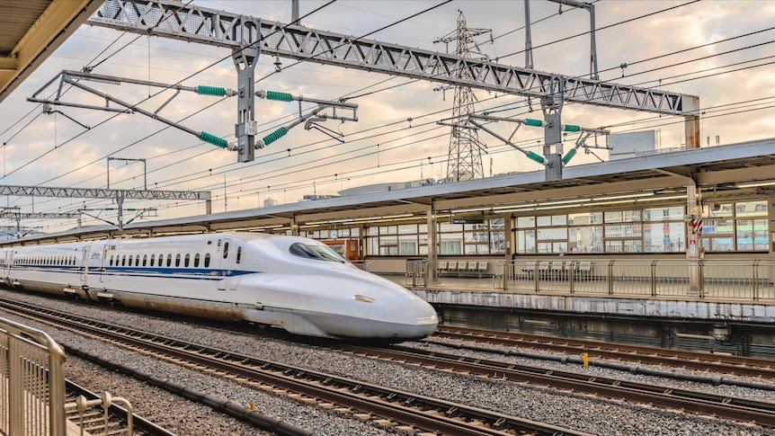 A Japanese bullet train docked at a station
