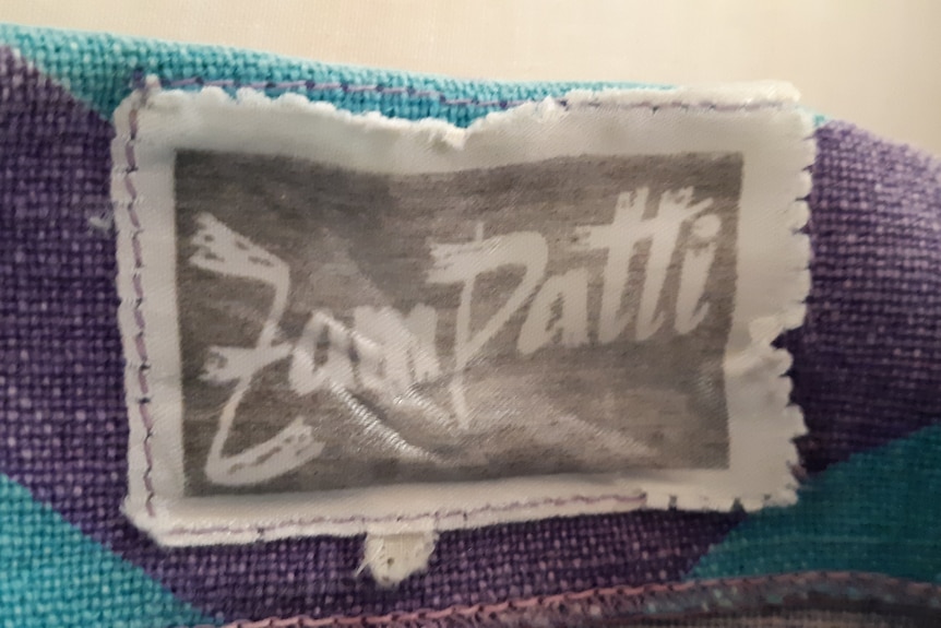 A clothing label up close that says Zampatti.