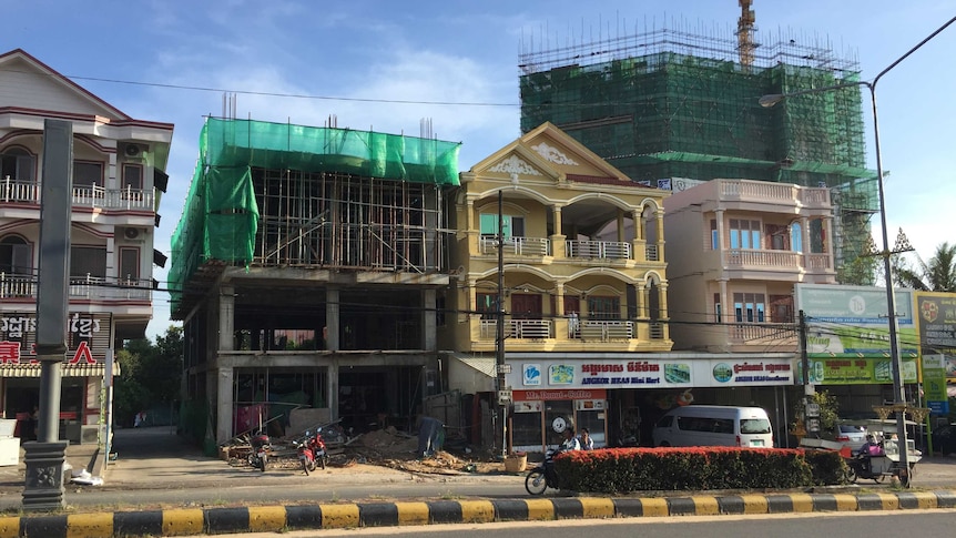 Houses sit among construction sites in the town of Sihanoukville, in Cambodia.