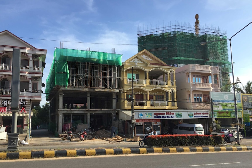 Houses sit among construction sites in the town of Sihanoukville, in Cambodia.