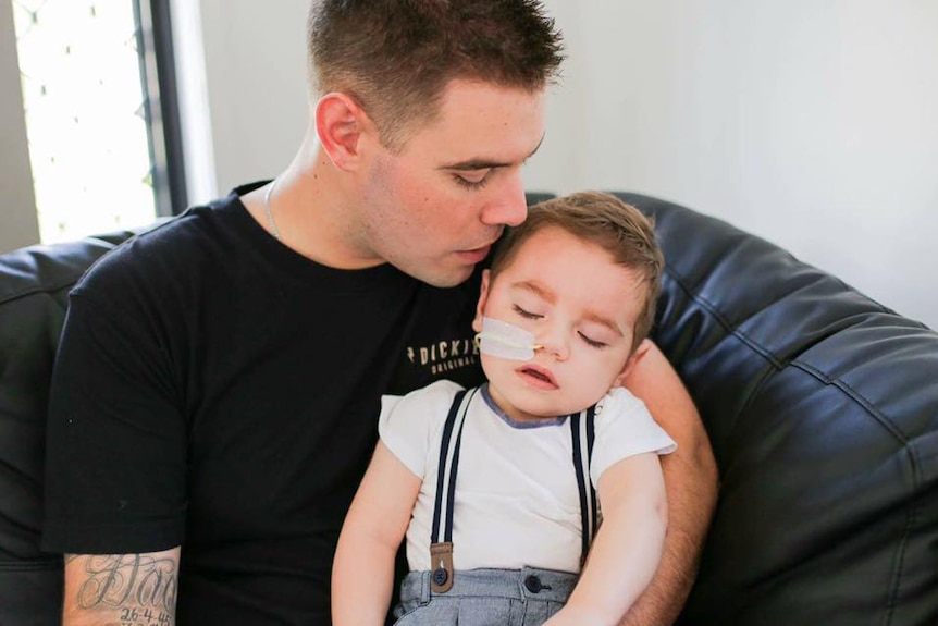 James Flaskas, with his 20-month-old son Tyler, in his north Queensland home