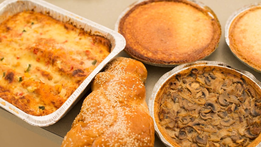 Kosher foods - vegetable  lasagne, cheese pie, mushroom tart and bread.