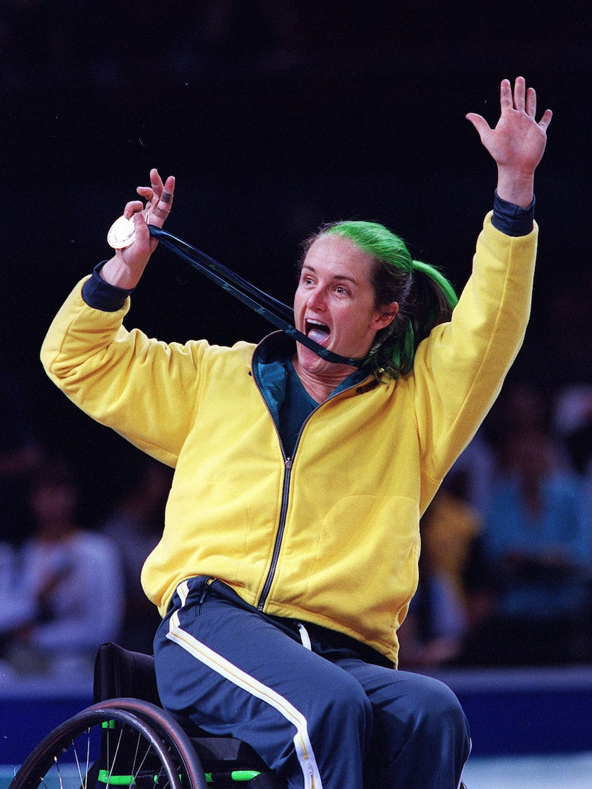 Liesl Tesch holds up her Silver medal