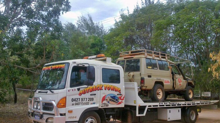 A towtruck removes Malcolm Douglas's 4wd from the crash site