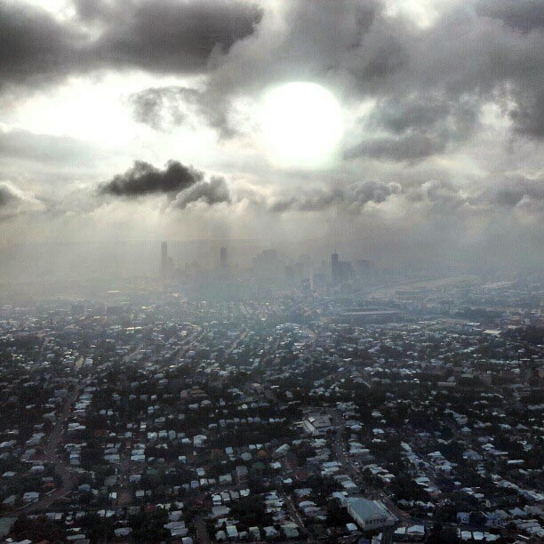 Smoke haze from bushfires including a blaze on Bribie Island hung over Brisbane this morning.