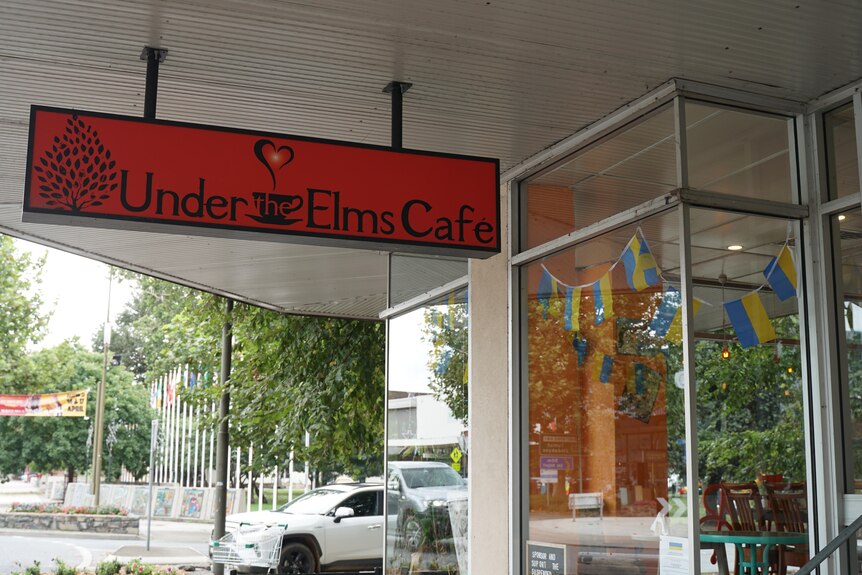 A sign for under the elms cafe