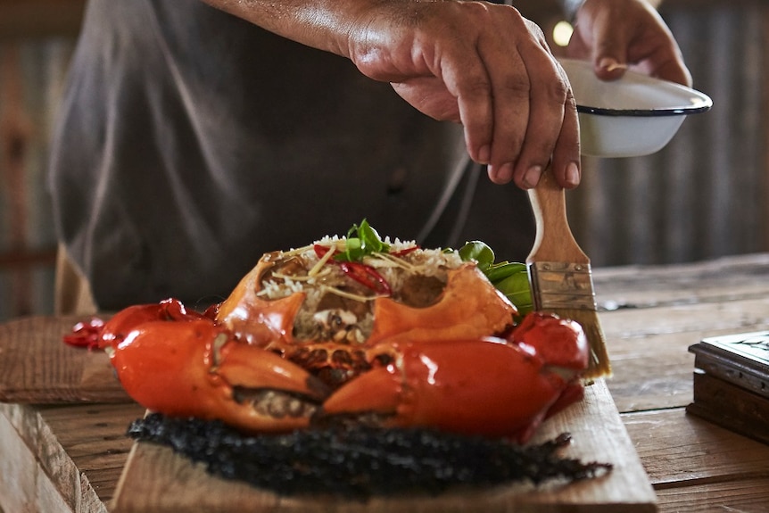 Warwick Thornton prepares a crab meal he cooked in The Beach documentary.