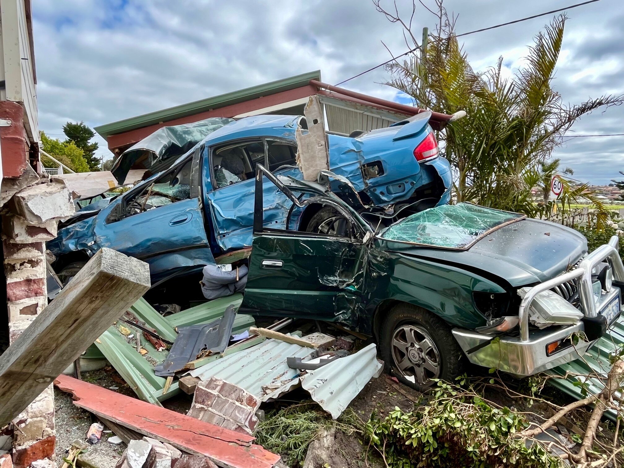 Car crashes into Albany home, leaving trail of destruction and debris