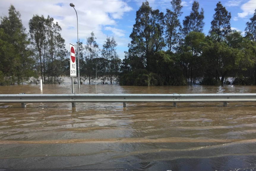 Flood waters to the side of the Pacific Highway.