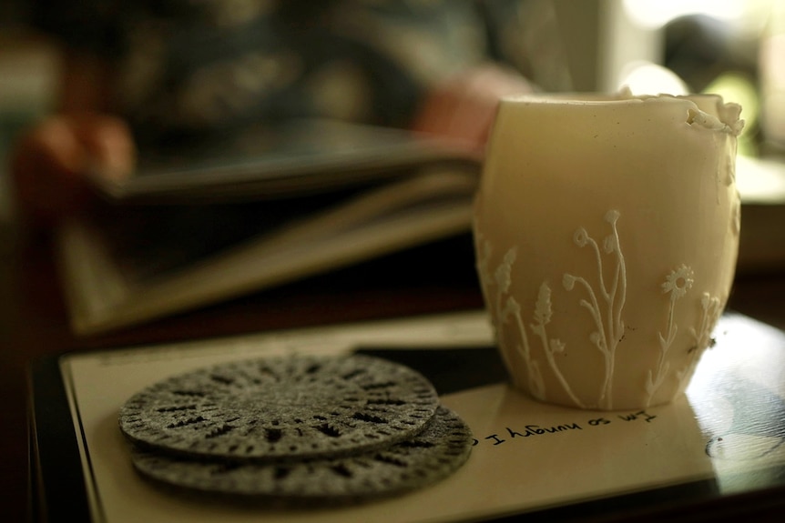 A candle and coasters.