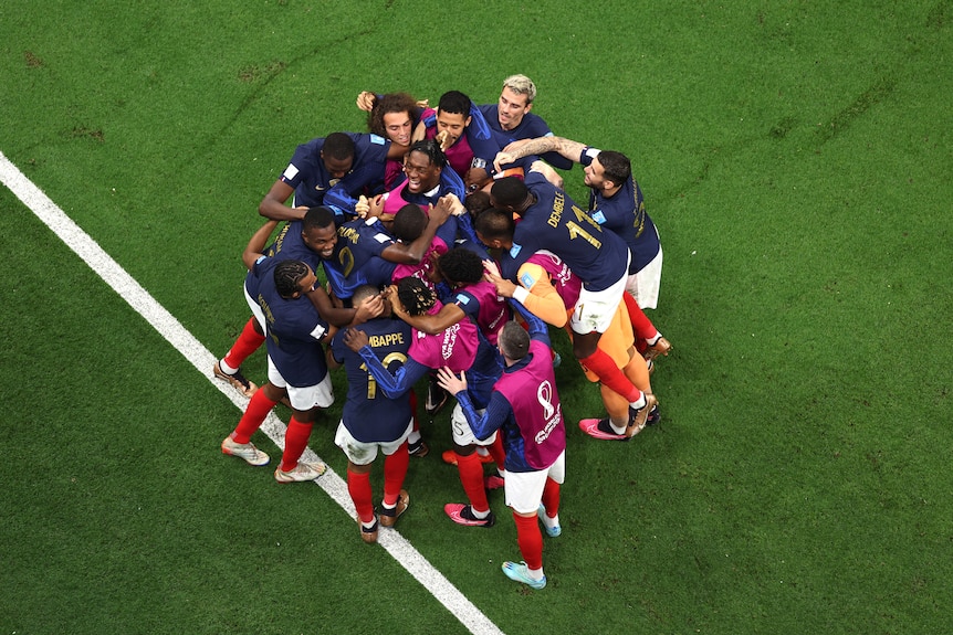 France players celebrate in a group