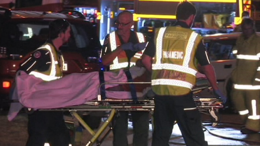 Paramedics transfer a crash victim