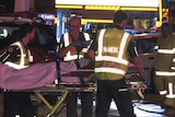 Paramedics transfer a crash victim