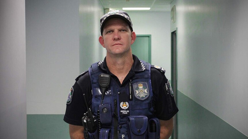 Senior Sergeant Brad Inskip stands in a corridor at Mount Isa police station on January 14, 2018.