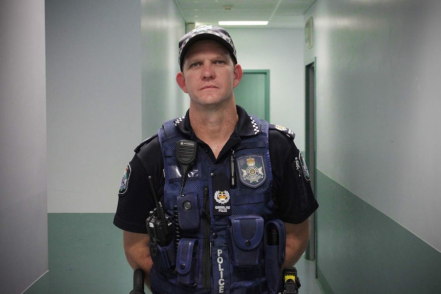 Senior Sergeant Brad Inskip stands in a corridor at Mount Isa police station on January 14, 2018.