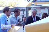 Liberal MP Malcolm Turnbull helps out with campaigning on a ferry in Brisbane on July 22, 2010.