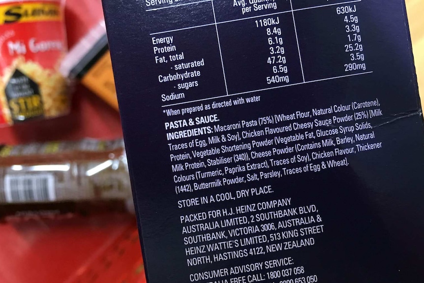 Close up of the nutritional information on a package of instant macaroni and cheese.