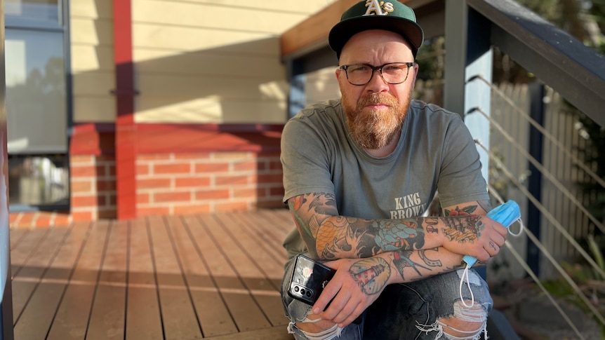 a man sitting on a porch