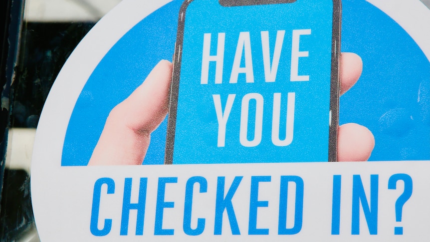 A blue sign shows a hand with a phone and the words 'HAVE YOU CHECKED IN?'.
