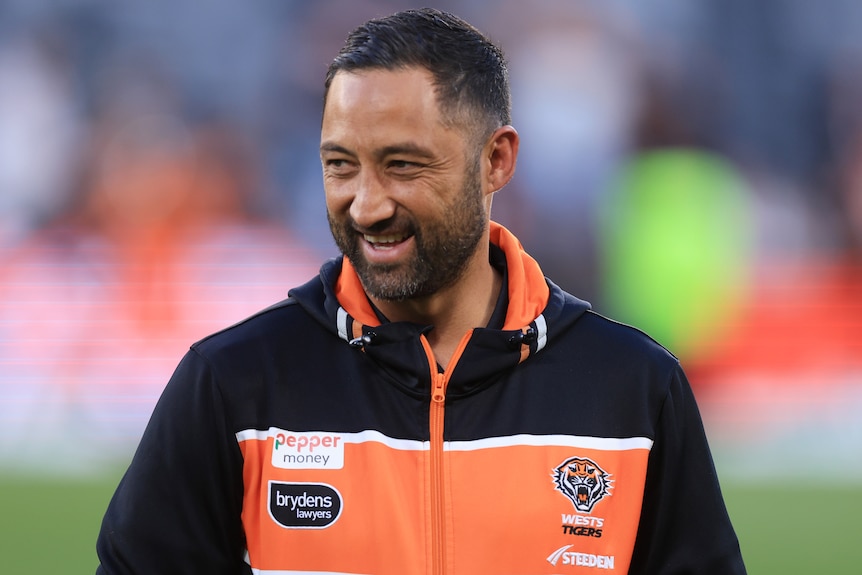 Benji Marshall smiles as he looks to his right after Wests Tigers defeated the Dolphins in their NRL match.