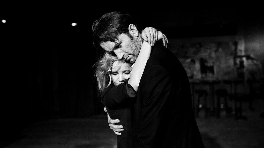 Black and white still of Joanna Kulig embracing Tomasz Kot in 2018 film Cold War.