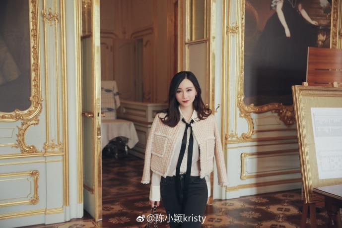 Chinese social media influencer Xiaoying Chen. She is in what appears to be an opulent mansion wearing expensive clothes.