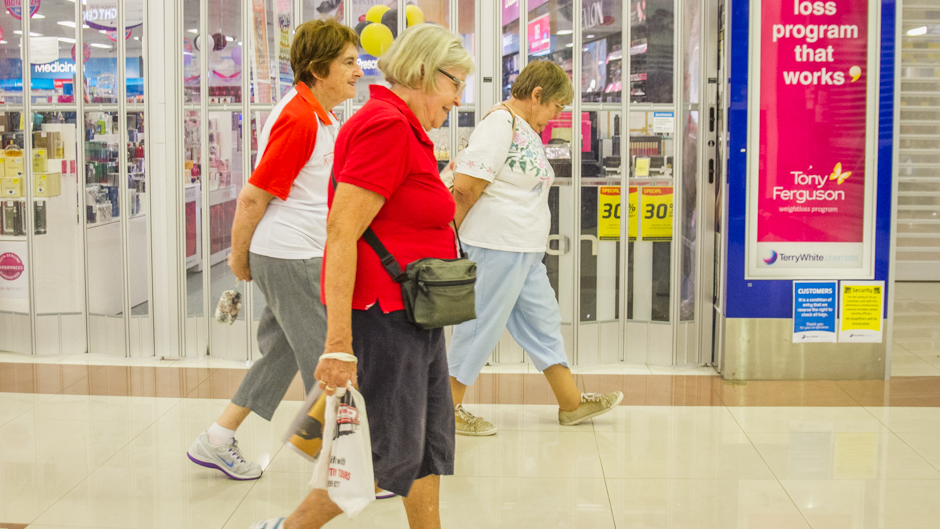 Walkers move throughout the centre early in the morning while the stores are closed.