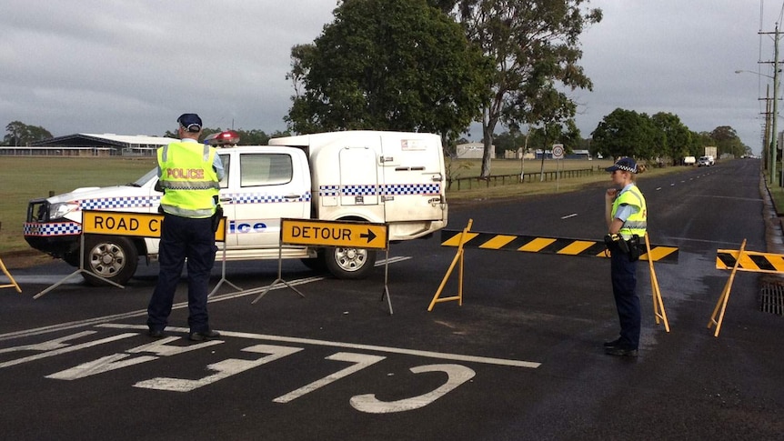 Police near Bundaberg showgrounds where a man's body was discovered.