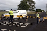 Police near Bundaberg showgrounds where a man's body was discovered.