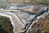 An aerial image of an open-air mine site.