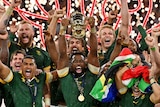 South Africa celebrates with the Webb Ellis Cup after winning the Rugby World Cup final.