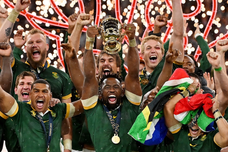 South Africa celebrates with the Webb Ellis Cup after winning the Rugby World Cup final.