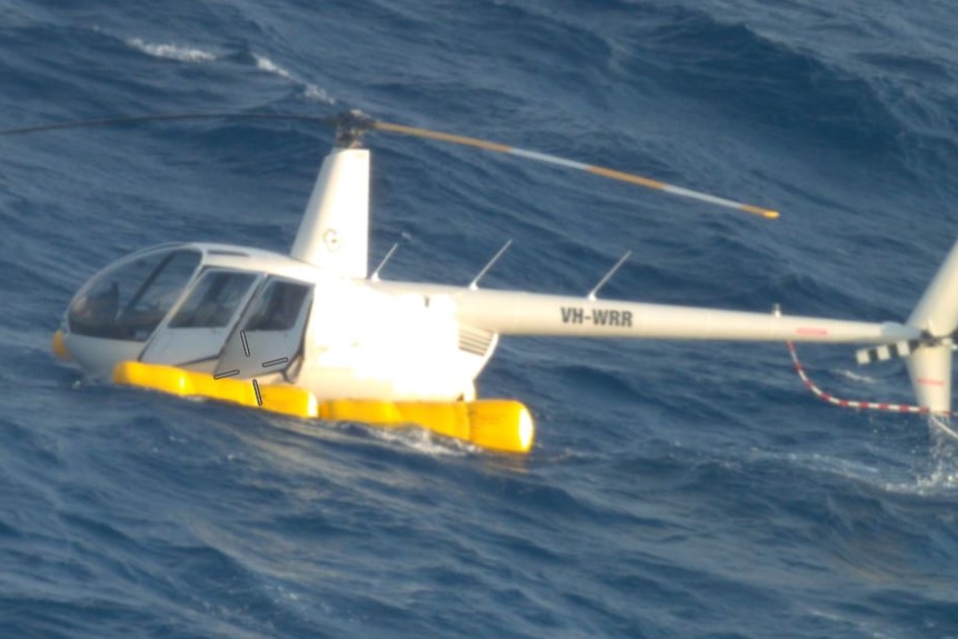 A helicopter operated by Whitsunday Air Services in water north of Hamilton Island.