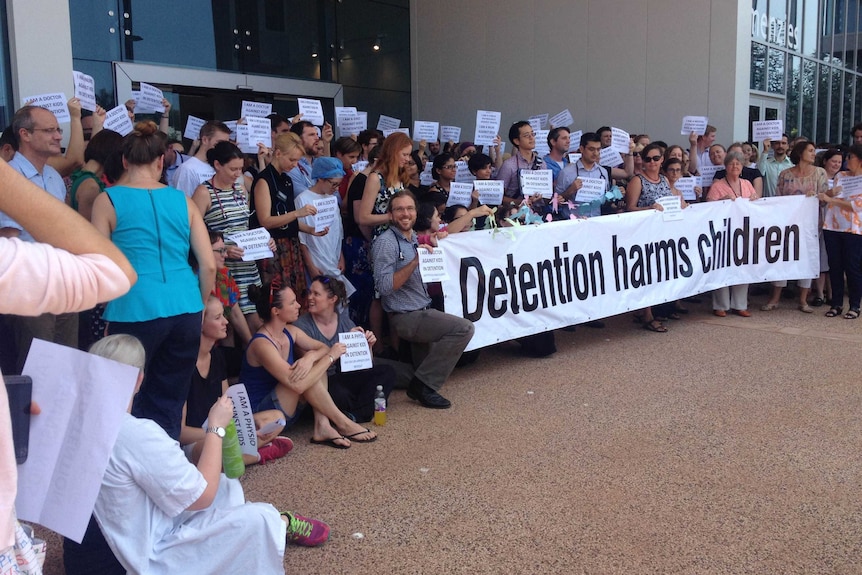 Around 200 doctors, nurses and other health workers gathered outside Royal Darwin Hospital to join the protest over kids in detention