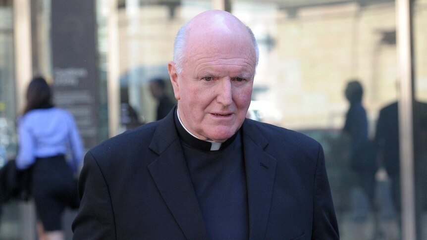 Melbourne Archbishop Denis Hart leaves the court after appearing before the royal commission.