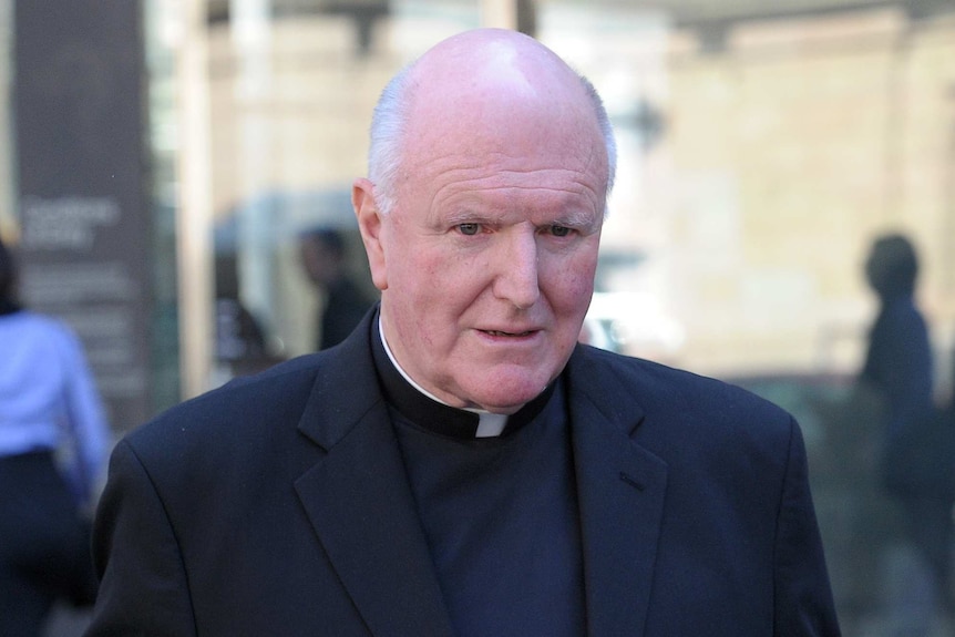 Melbourne Archbishop Denis Hart leaves the court after appearing before the royal commission.