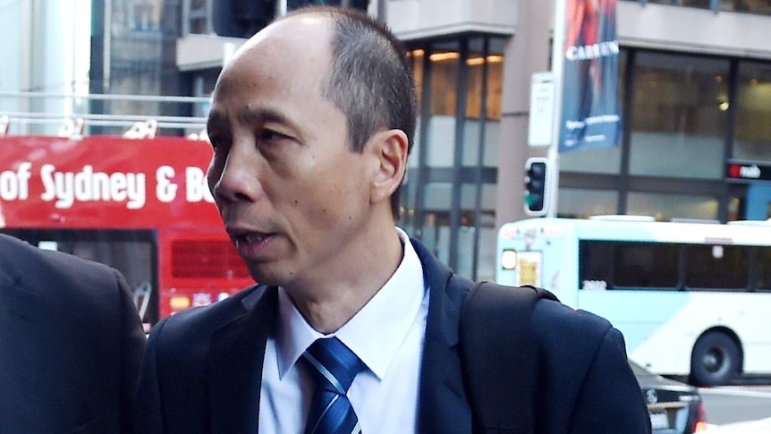 Robert Xie arrives at court