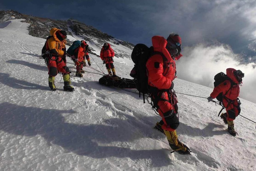rescuers rescuing an Australian man from Mount Everest