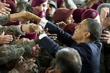 US President Barack Obama shakes hands with US Army troops after speaking with them at Fort Bragg