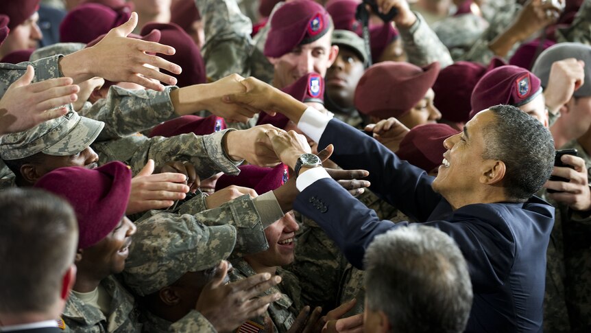 US President Barack Obama shakes hands with US Army troops after speaking with them at Fort Bragg
