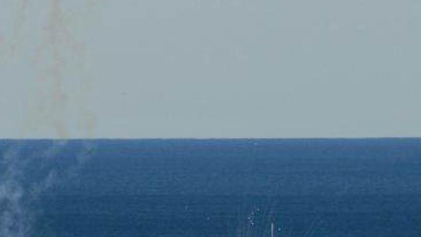 Flame erupts as HMAS Adelaide scuttling begins