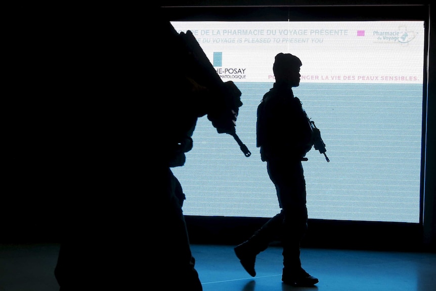 French soldiers patrol at Roissy Charles De Gaulle international airport