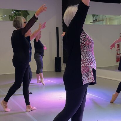 Over 55s take part in a ballet class. 