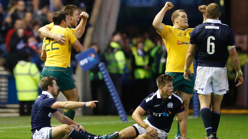 Australia's Nick Phipps and Dane Haylett-Petty celebrate victory over Scotland at Murrayfield.
