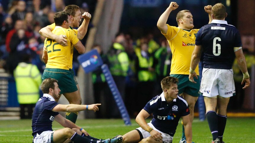 Australia's Nick Phipps and Dane Haylett-Petty celebrate victory over Scotland at Murrayfield.