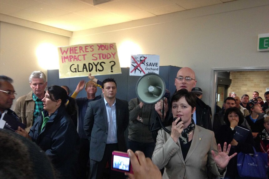 Mulgoa Liberal MP Tanya Davies speaks to protestors at South West rail link meeting