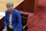 Penny Wong looks up in the Senate