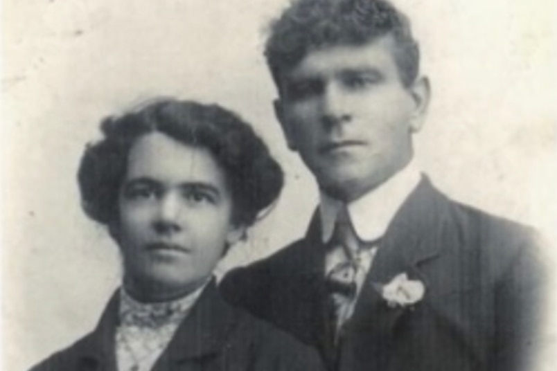 A black and white photo of a couple 
