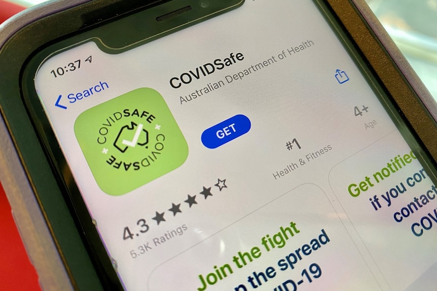 A photo of a smartphone with the app store open to the COVIDSafe app.