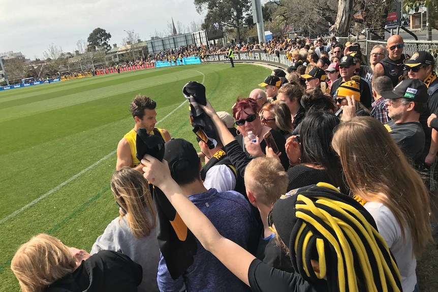 Alex Rance signs autographs after Richmond's training session at Punt Road Oval.